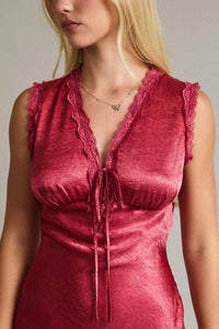 Red velvet sleeveless mini dress with ruffled neckline and lace trim