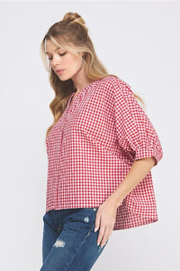 Red and white checkered dolman sleeve blouse with v-neck and gathered detailing