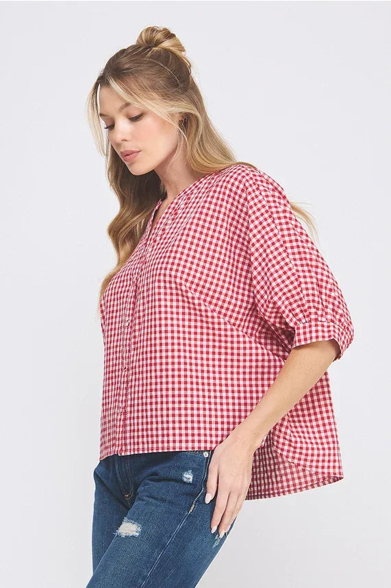 Red and white checkered dolman sleeve blouse with v-neck and gathered detailing