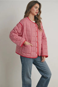 Buttoned quilted puffer jacket in red and white checkered pattern
