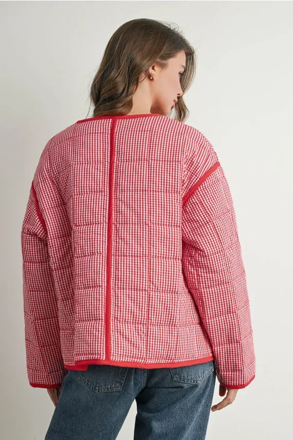 Red and white checkered buttoned quilted puffer jacket with hood