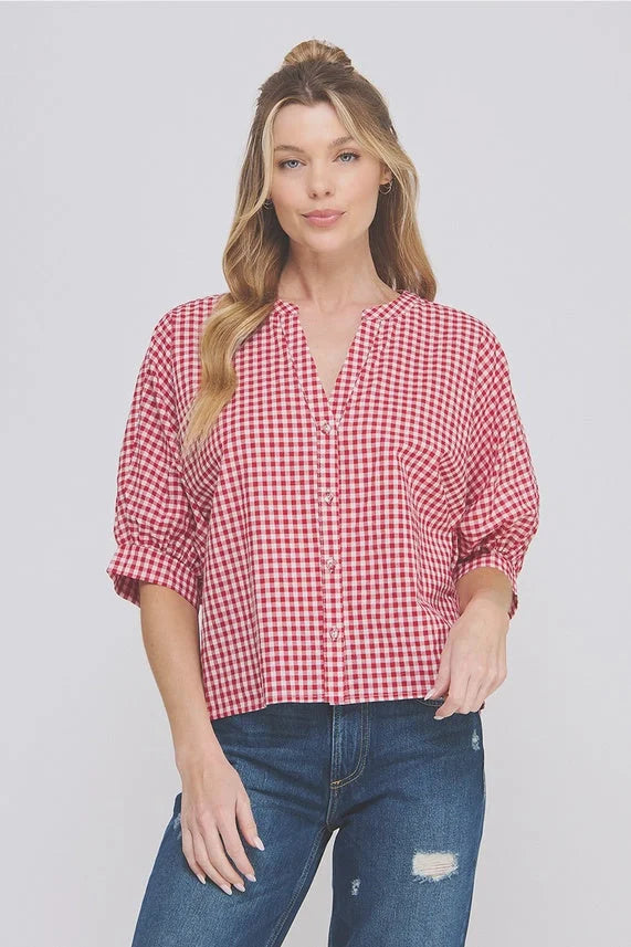 Red and white gingham dolman sleeve blouse with 3/4 length sleeves and distressed jeans