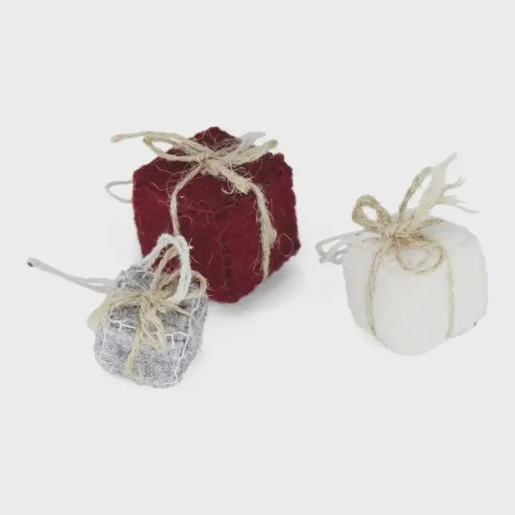 Handmade present ornament: red and white textured fabric gift box with jute ribbon