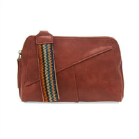 Reddish-brown vegan leather handbag with woven wristlet strap and zip closure