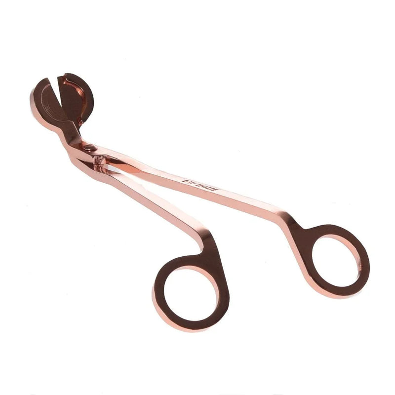 Rose gold wick candle trimmer featuring circular finger holes for precise trimming