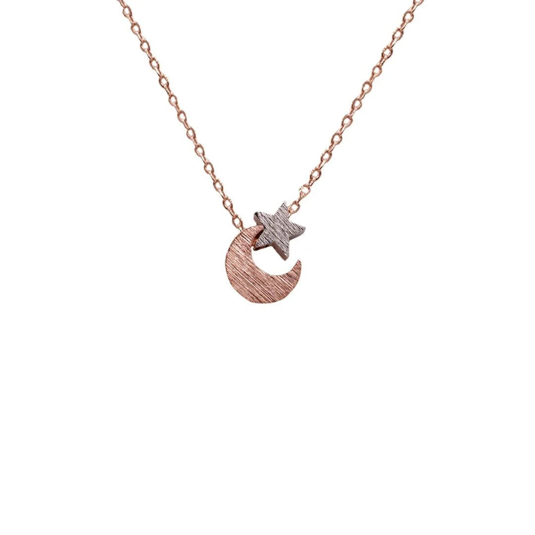 Rose gold Moon & Star necklace featuring a delicate small diamond accent