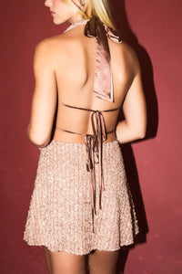 Rose gold sequins cowl neck mini dress with halter neck and lace-up back