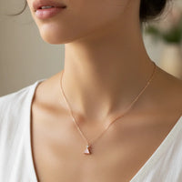 Rose gold gemstone triangle pendant necklace with minimalist design