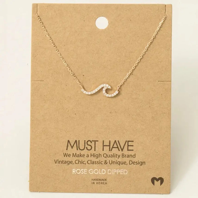 Rose gold wave necklace featuring a gold dipped pave wave pendant for elegant style