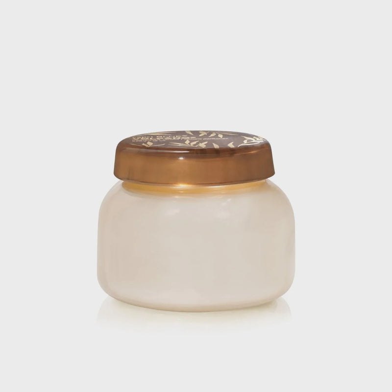Small round jar of cream with decorative bronze lid from Capri Blue Volcano collection