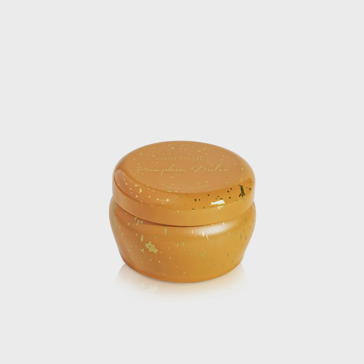 Round orange-brown Pumpkin Dulce Glimmer mini tin candle with glitter and lid
