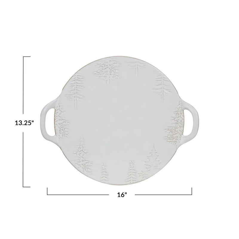 Round white debossed stoneware platter with handles, featuring a reactive glaze finish