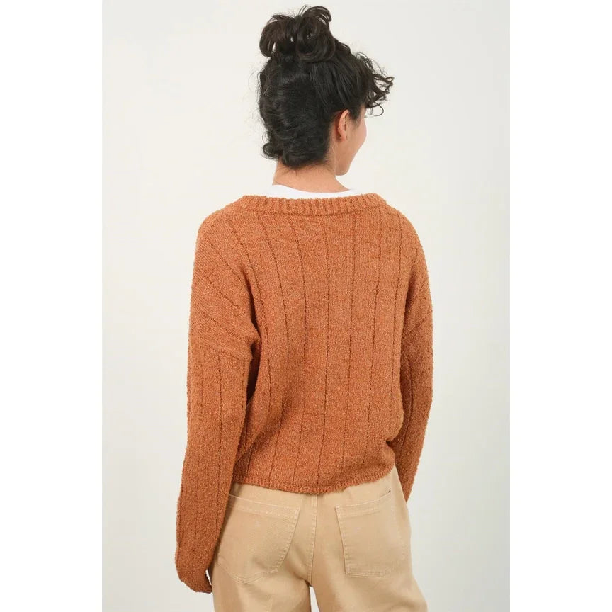 Rust-colored textured knit cropped sweater featuring ribbed pattern for stylish layering