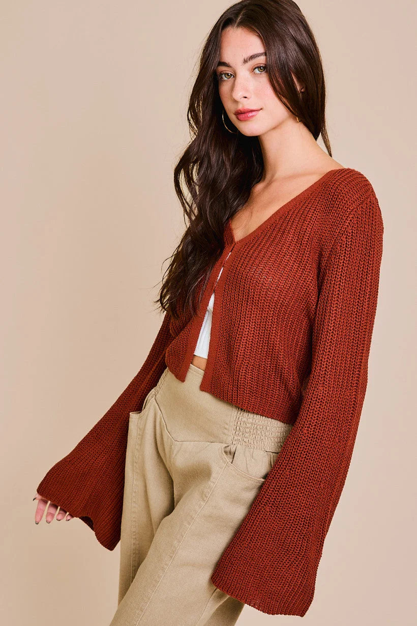 Rust-colored bell sleeve cardigan featuring a cropped design and wide sleeves