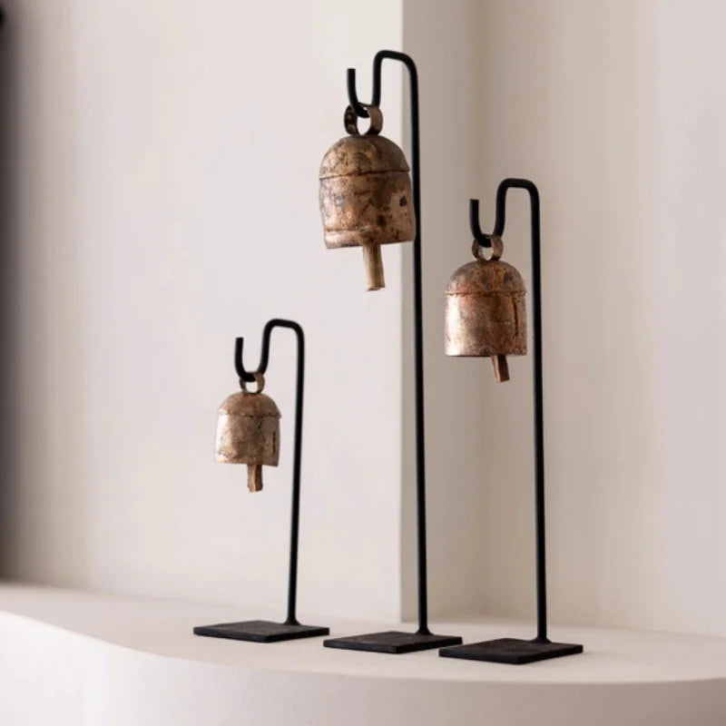 Vintage inspired iron bell stand with rustic metal bell on black base