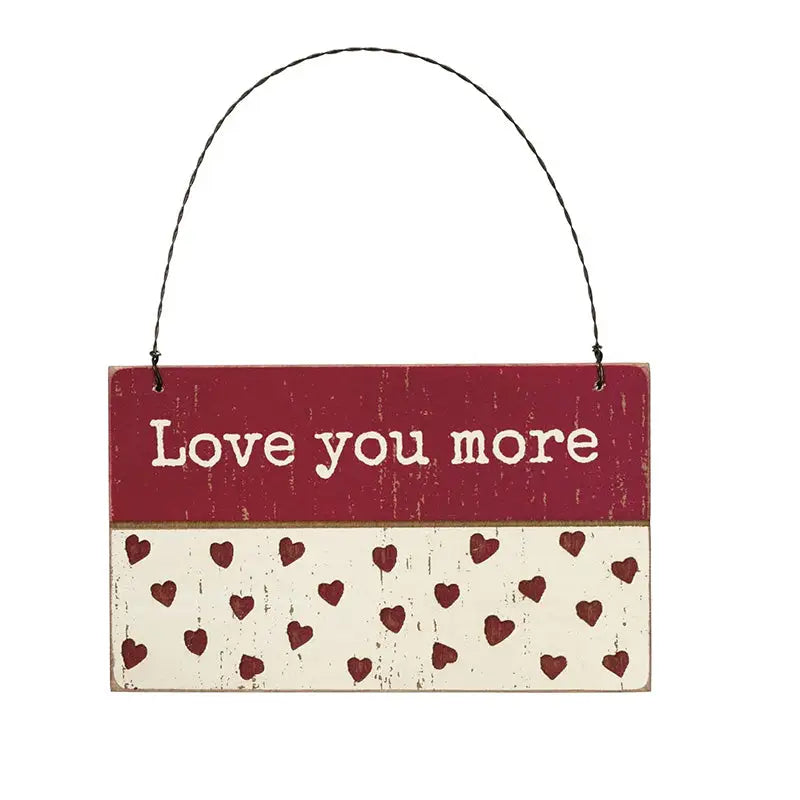 Rustic wooden hanging sign with love you more sentiment in red and cream colors