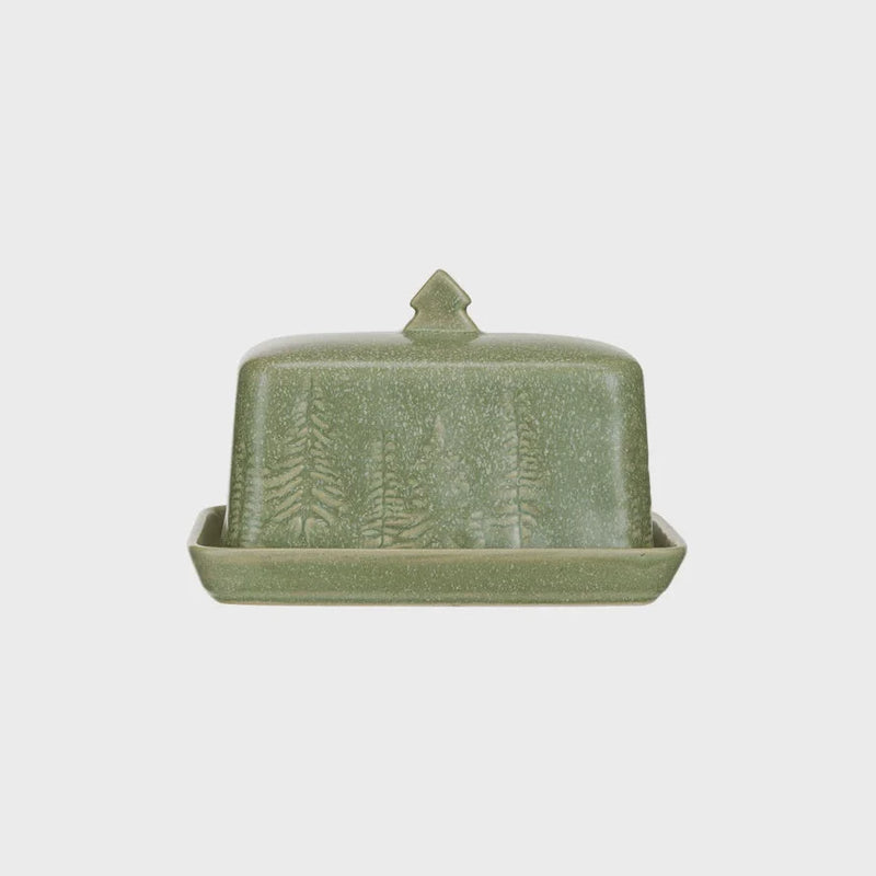 Sage green stoneware butter dish featuring an embossed pine tree design