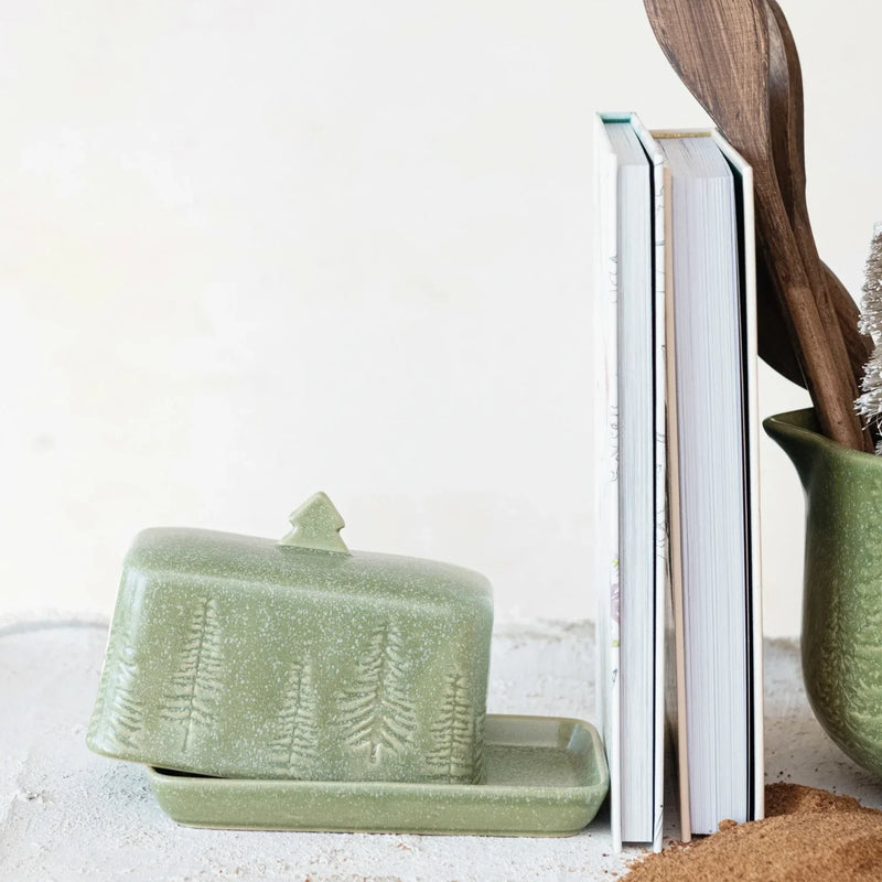 Sage green stoneware butter dish with pine tree pattern in a debossed design