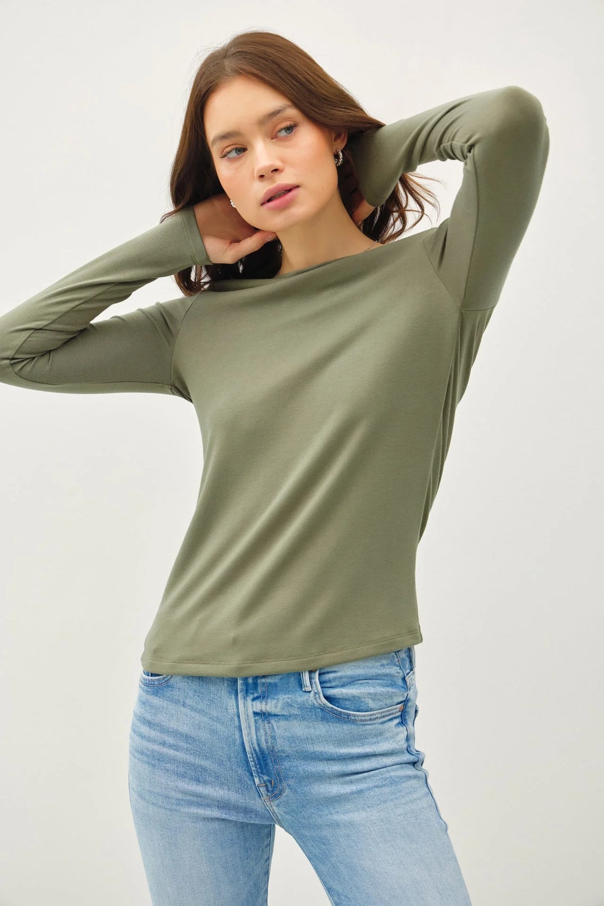 Sage green long sleeve top and light blue jeans styled with Basic Boat Neck Long Sleeve Knit Top