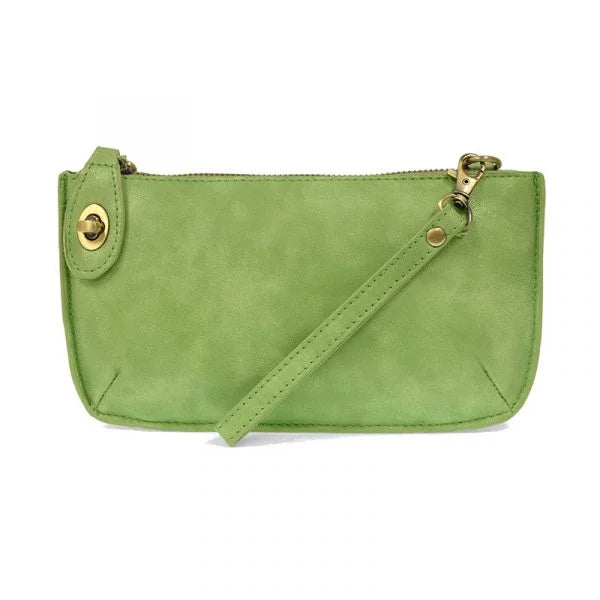 The Sak Mini Crossbody Bag featured in the Lux Crossbody Wristlet Clutch design