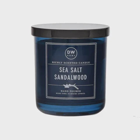 Scented Sea Salt Sandalwood candle in a blue glass jar with black lid