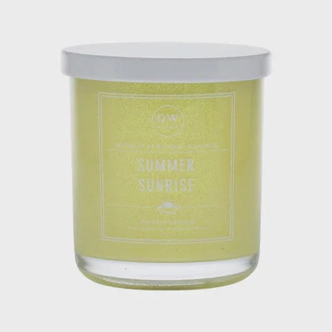 Scented candle in a glass jar with pale yellow label for Summer Sunrise Candle boho decor