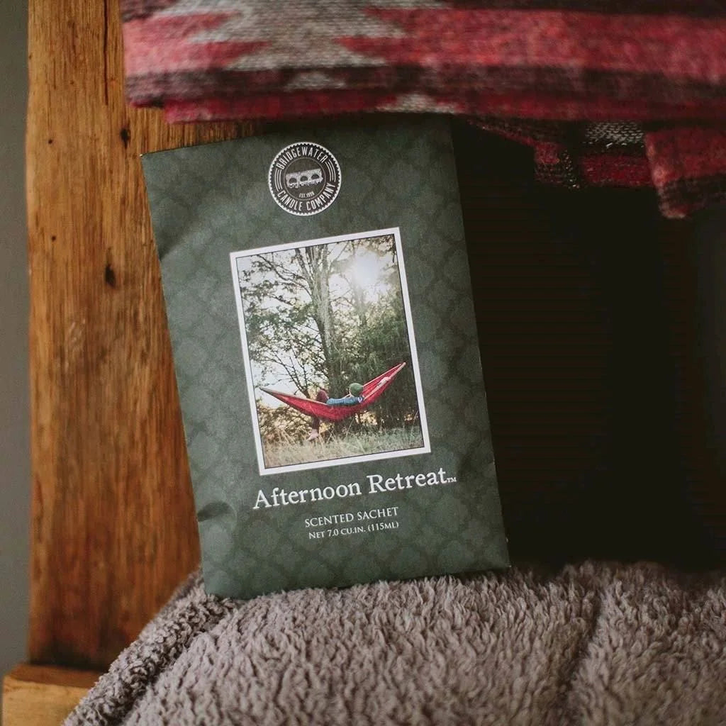 Afternoon Retreat Scented Sachet featuring a red hammock in a boho forest setting