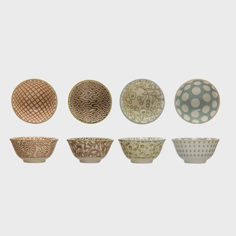 Set of decorative stoneware pinch pots with unique patterns and matching lids