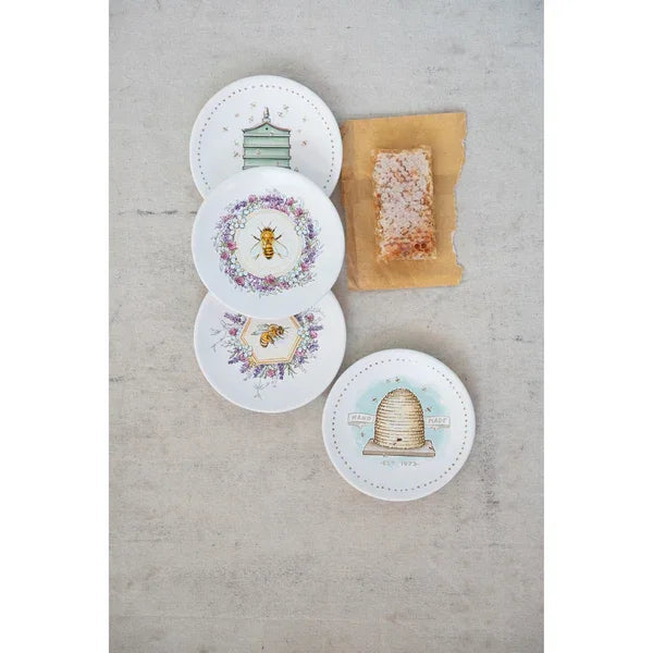 Set of decorative boho stoneware plates featuring bee and beekeeping illustrations