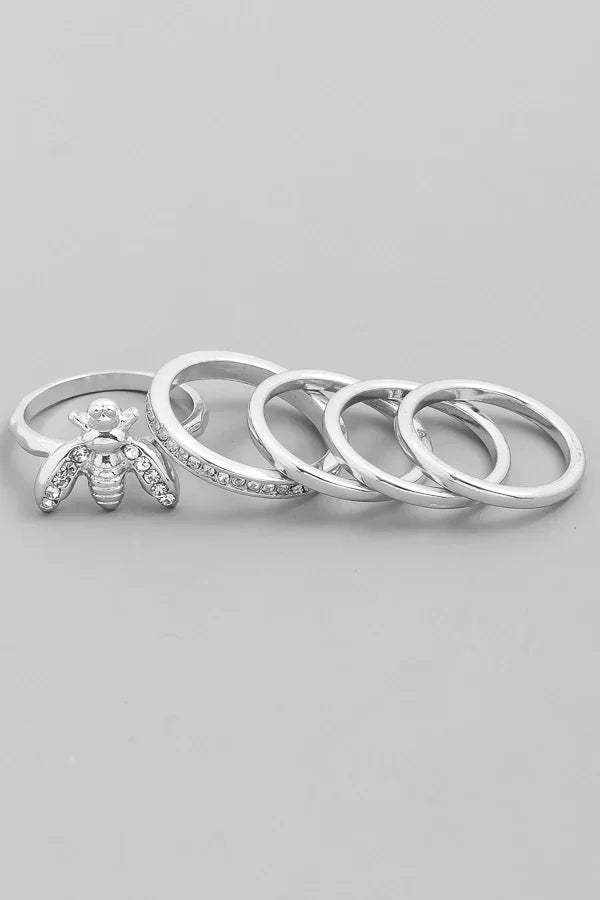 Set of five silver-toned stackable rings, including a bee ring with crystal accents