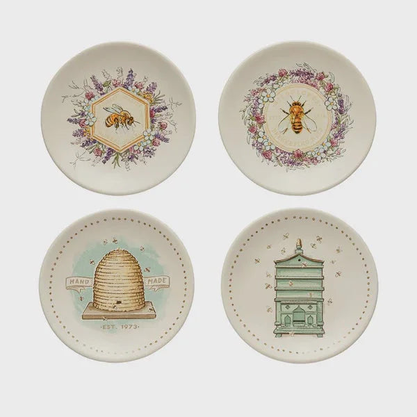 Set of four decorative stoneware plates with bee and beekeeping-themed illustrations