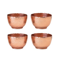 Set of four hammered metal bowls with jute tie for boho-style decor