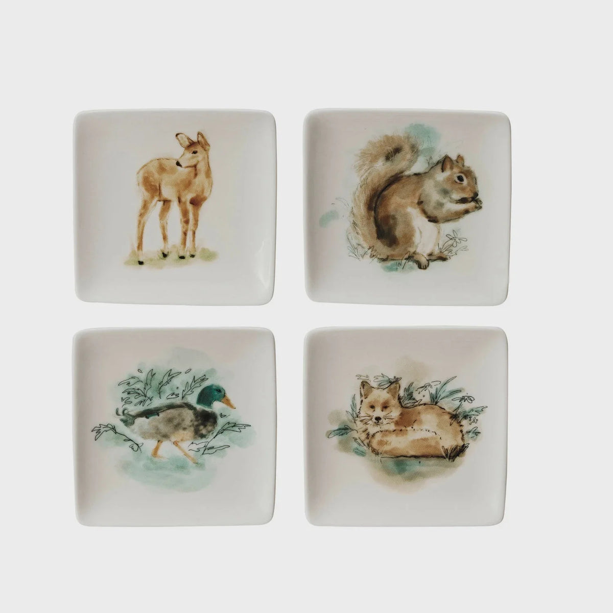 Set of four square stoneware dishes with watercolor woodland animal illustrations