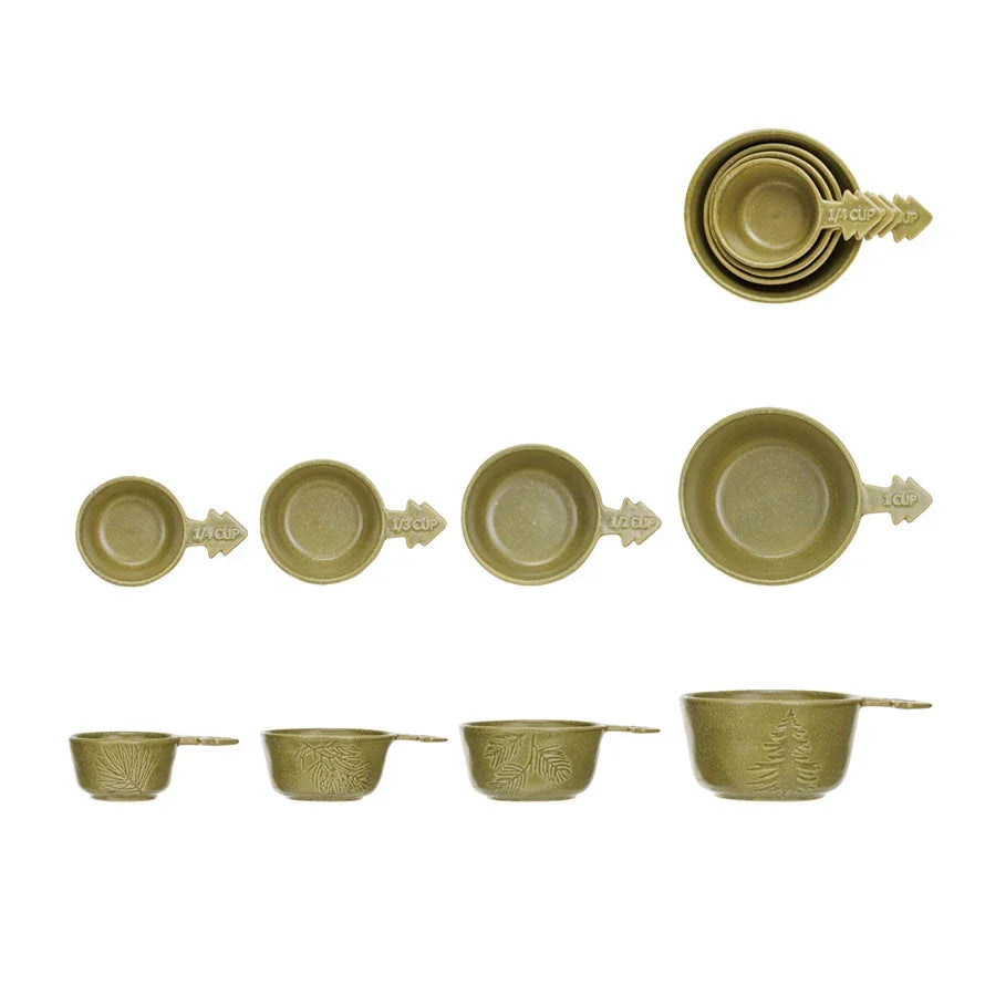 Olive green stoneware tree measuring cups with decorative handles showcased elegantly