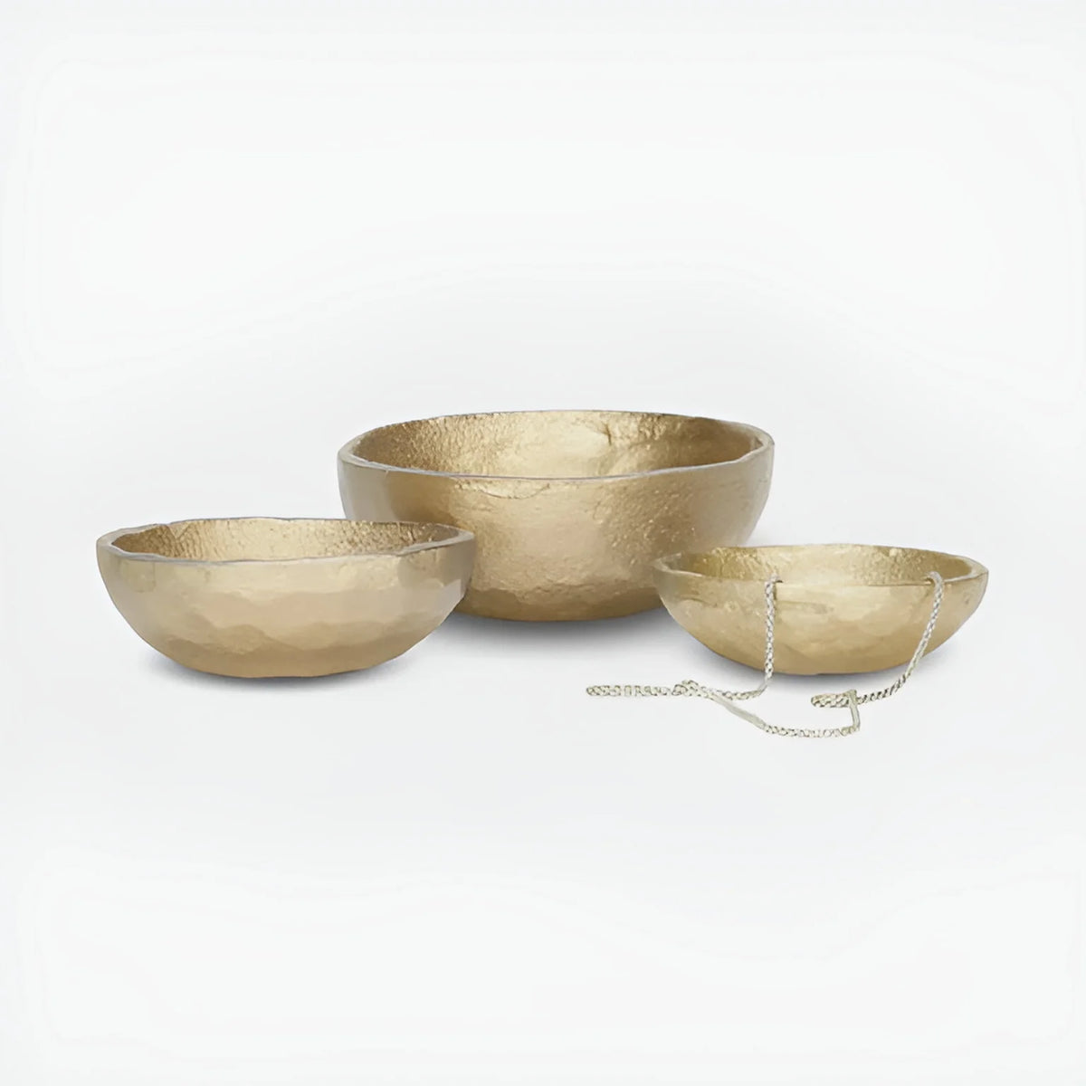 Set of three gold-colored decorative aluminum bowls with a mallet, perfect for boho decor