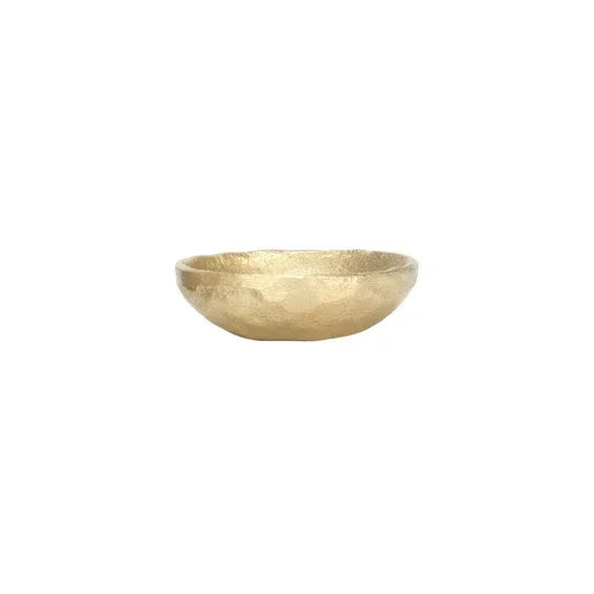 Shallow gold-colored decorative cast aluminum bowl with textured surface for a boho vibe