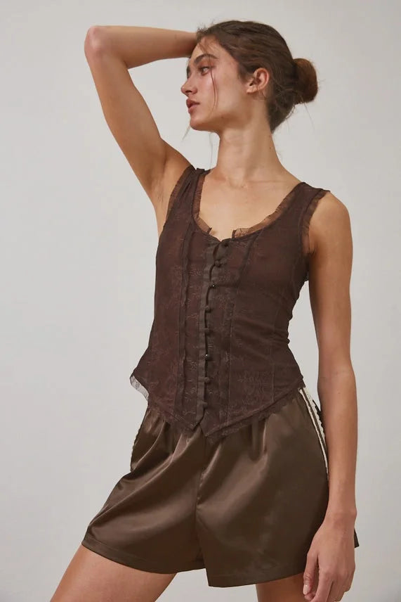 Sheer dark brown sleeveless tank top with ruffled trim and lace button closure