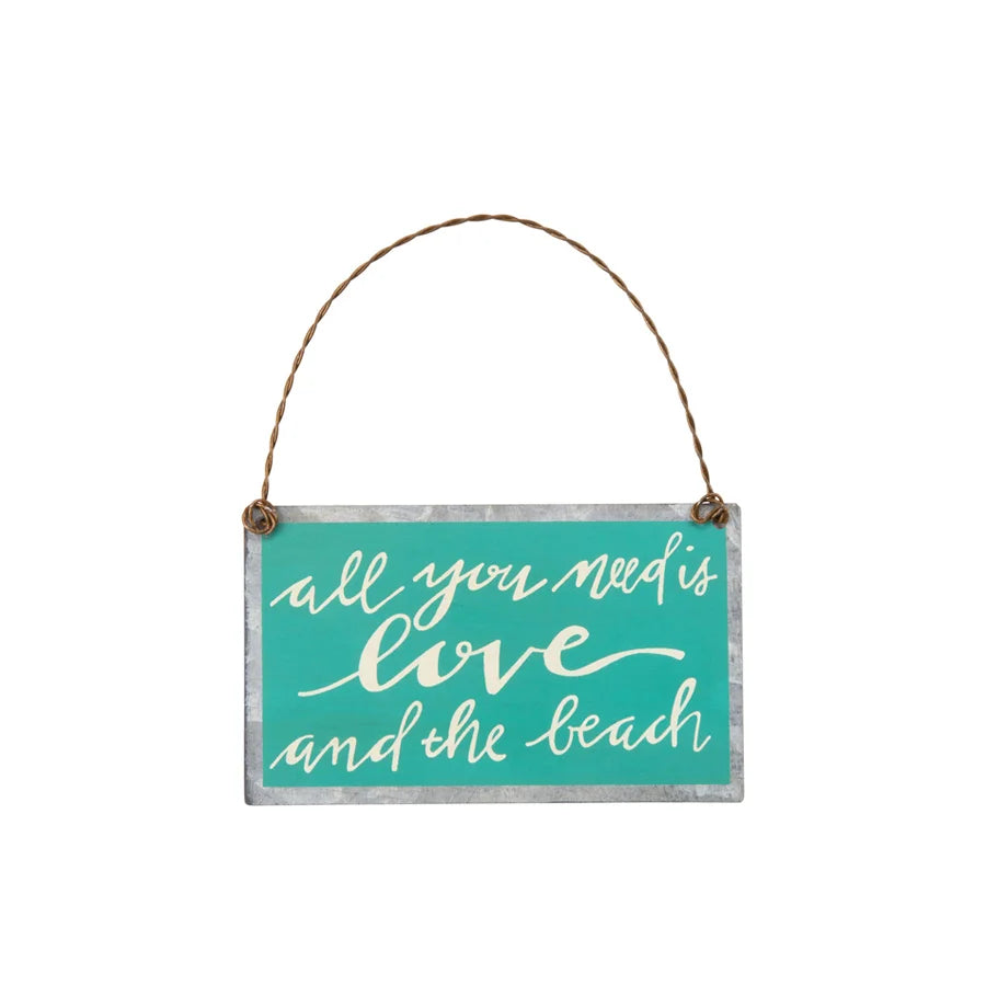 Love ornament sign featuring the phrase all you need is love and the beach