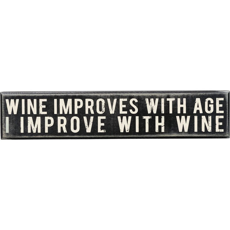 Wall decor featuring a sign that says wine improves wine for Daisy Lane enthusiasts