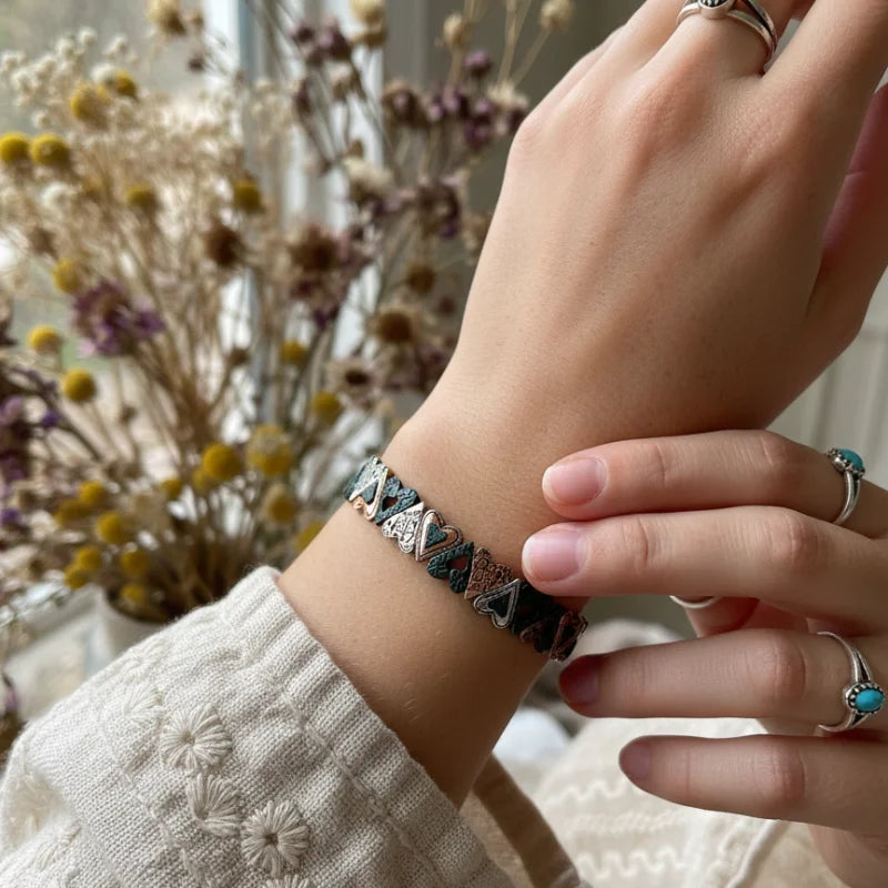 Silver and black beaded Bohemian Live Love Laugh bracelet with geometric pattern