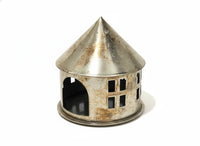Rustic bohemian metal miniature castle with pointed roof and arched entrance