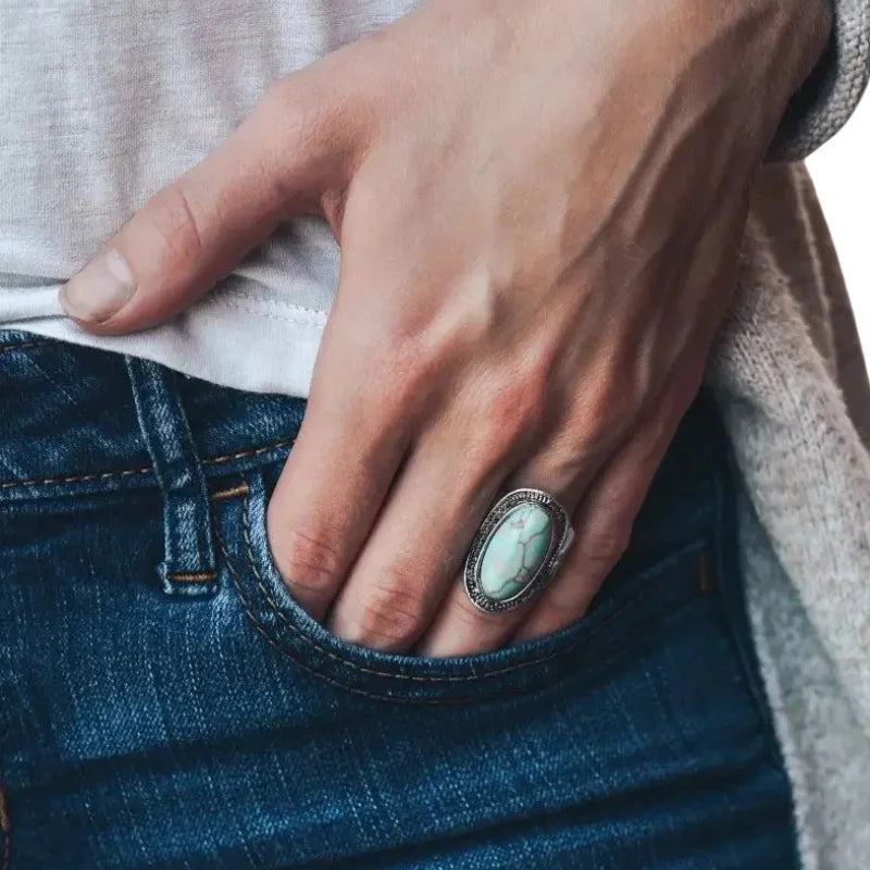 Vintage turquoise ring with silver oval stone and intricate detailing