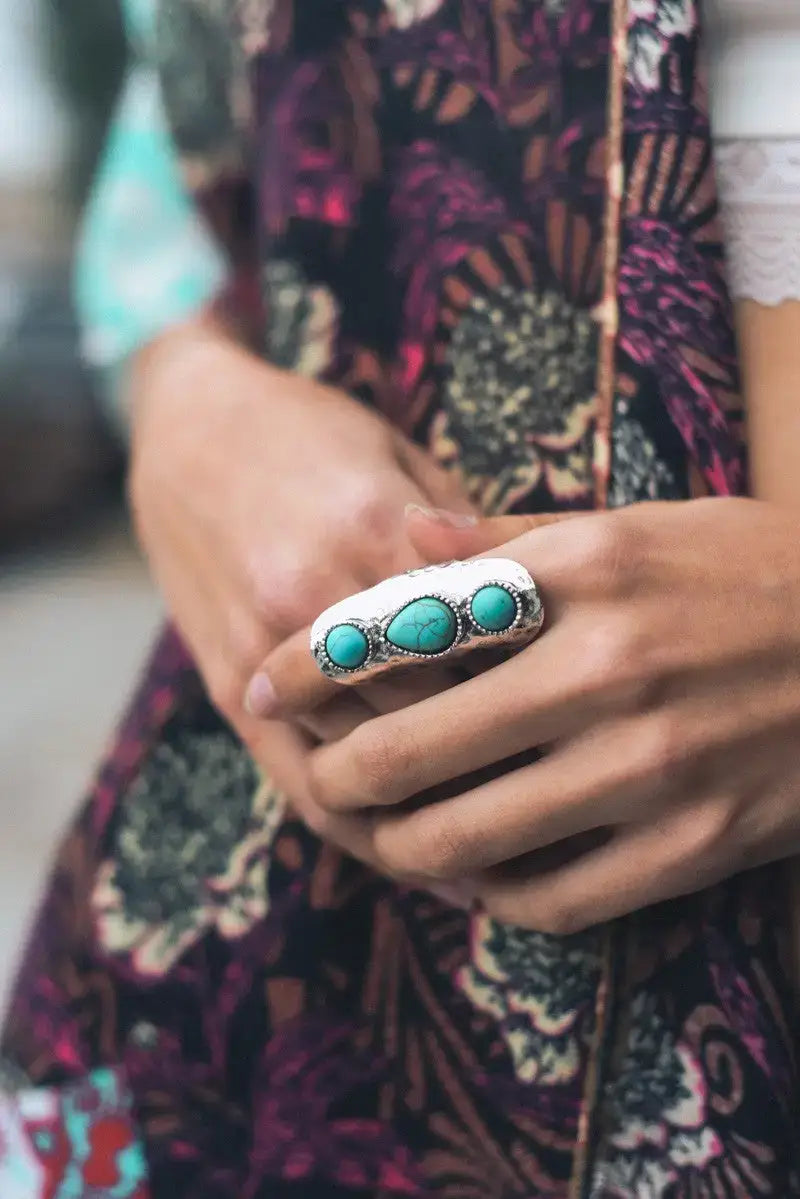 Adjustable silver ring with three vibrant turquoise stones for elegant jewelry styling