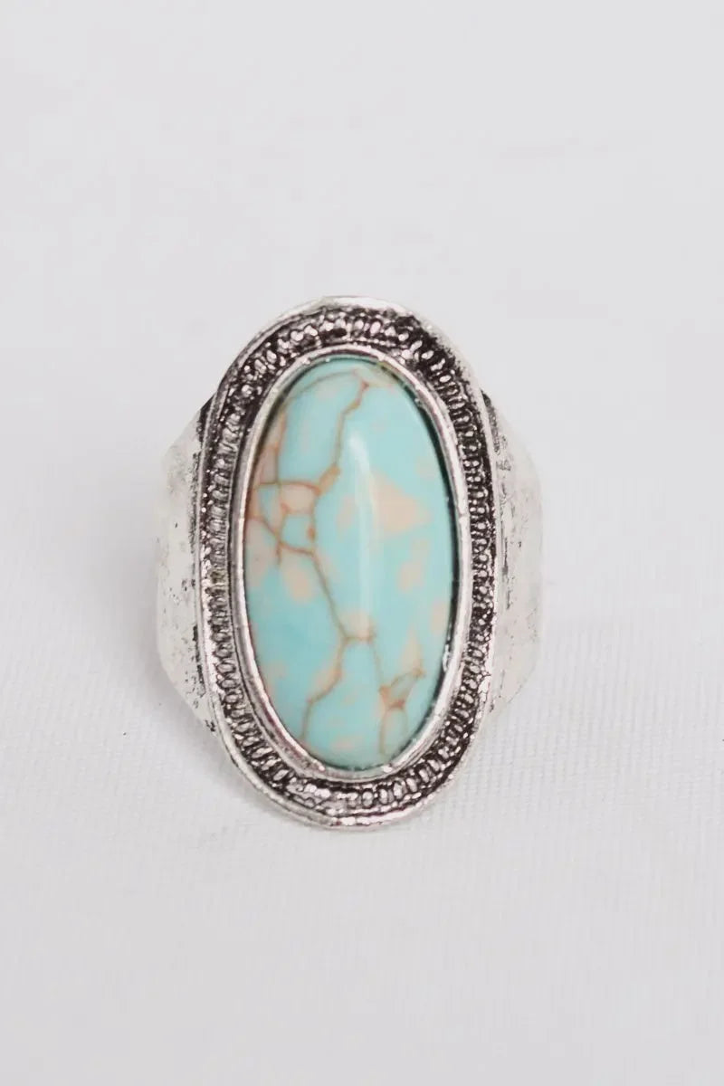 Silver vintage turquoise ring featuring a polished turquoise stone for elegant jewelry style