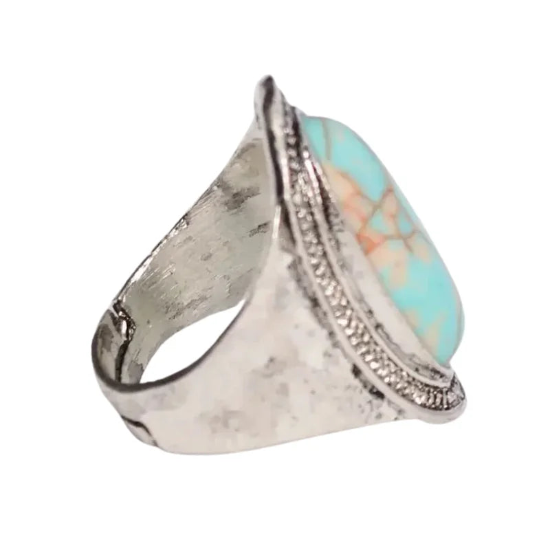 Vintage turquoise ring with silver stone and intricate detailing