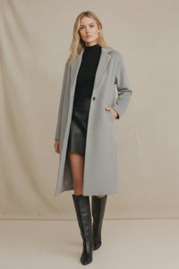 Oversized fit earthy long coat in sleek light gray wool with double-breasted design