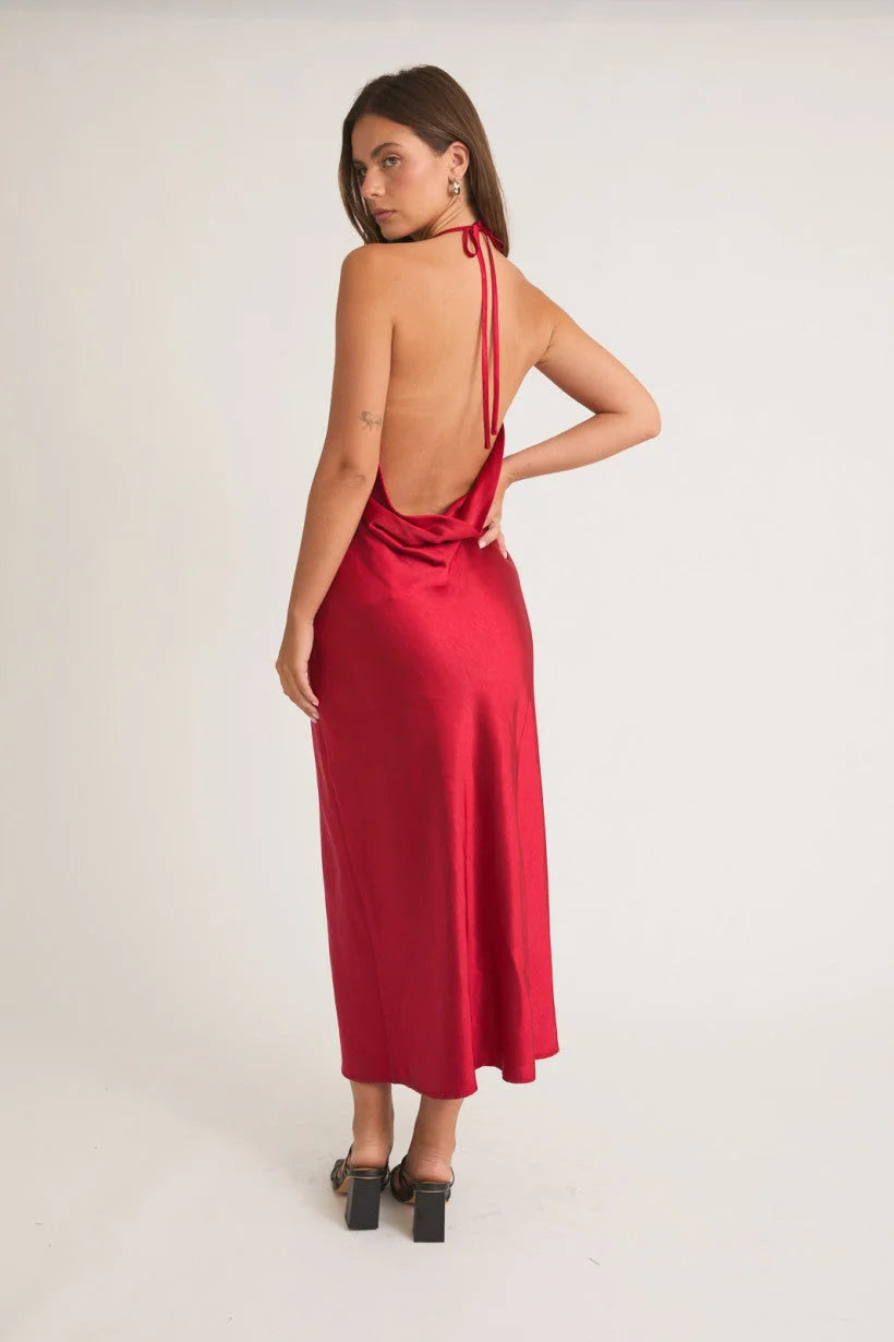 Sleek red backless satin midi dress with halter neckline from Shop Daisy, women’s boho chic clothing