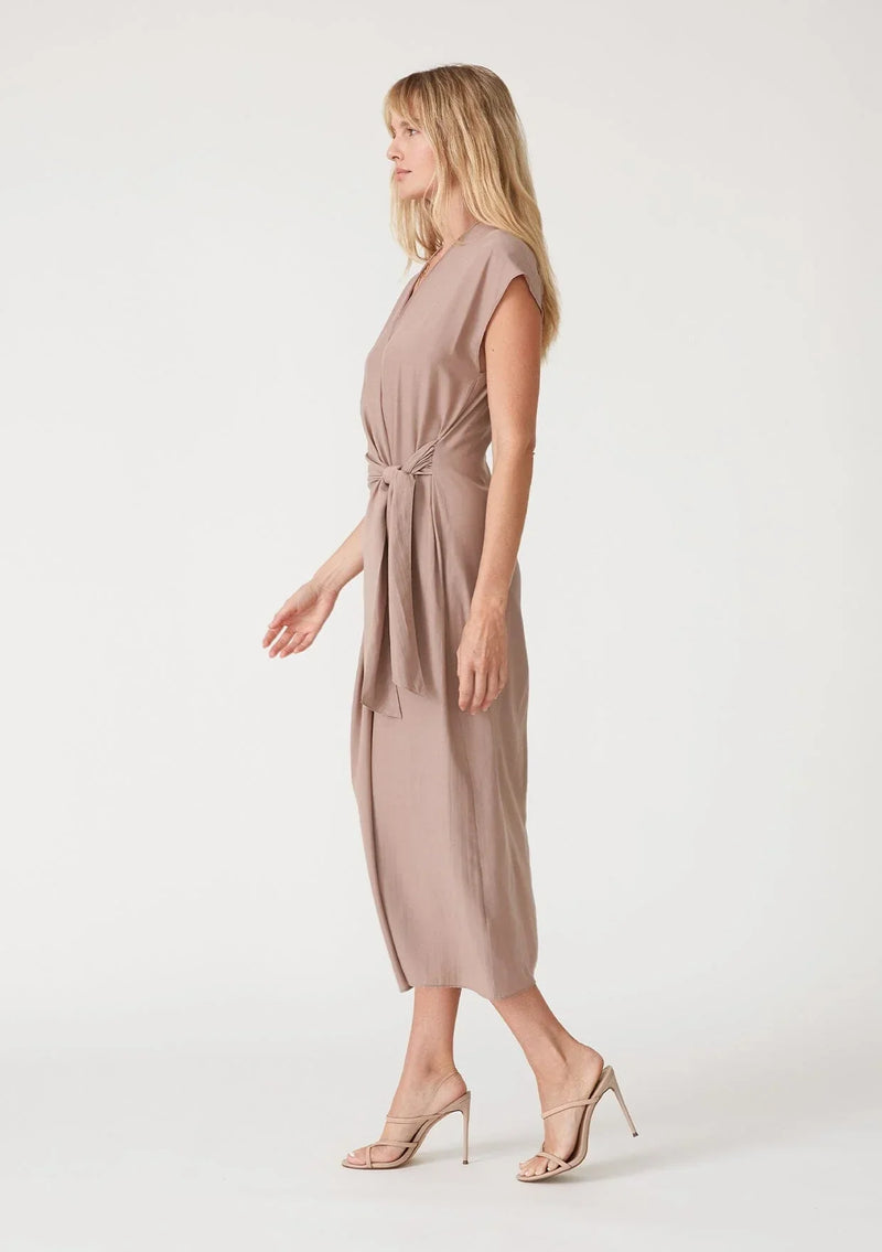 Sleeveless blush pink midi wrap dress with gathered waist detail, perfect for any occasion