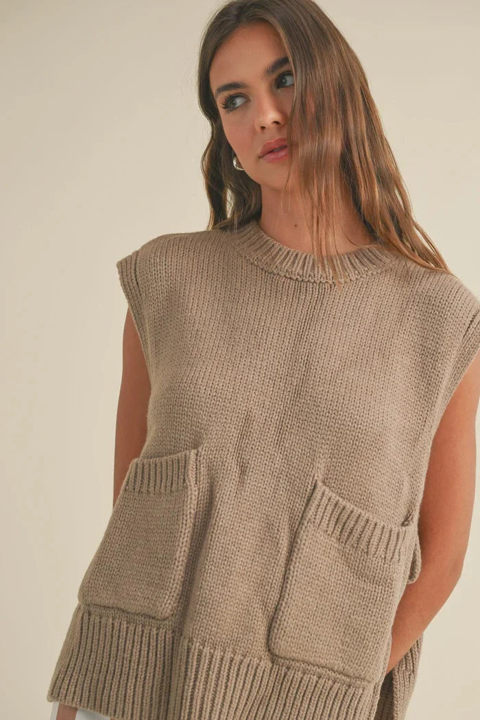 Sleeveless beige knit sweater vest with pockets from Shop Daisy’s women’s boho chic clothing