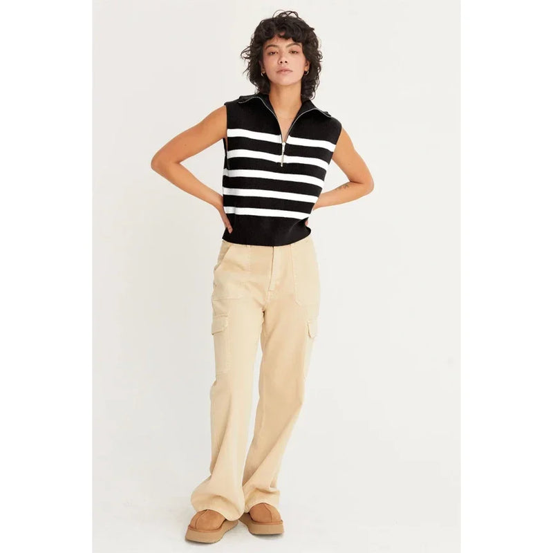 Sleeveless black and white striped sweater vest styled with cargo pants and tan boots, Shop Daisy